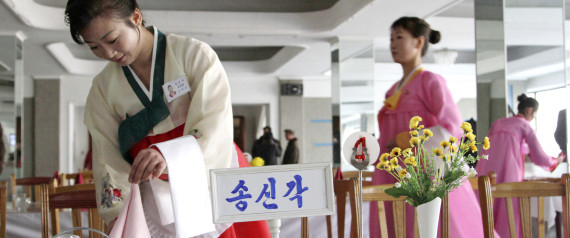 A North Korean waitress folds a napkin before the start of a cooking competition held at a noodle restaurant in Pyongyang, North Korea, on Thursday, Nov. 22, 2012. Cooks and servers from around North Korea took part in the three-day cooking competition. (AP Photo/Jon Chol Jin)